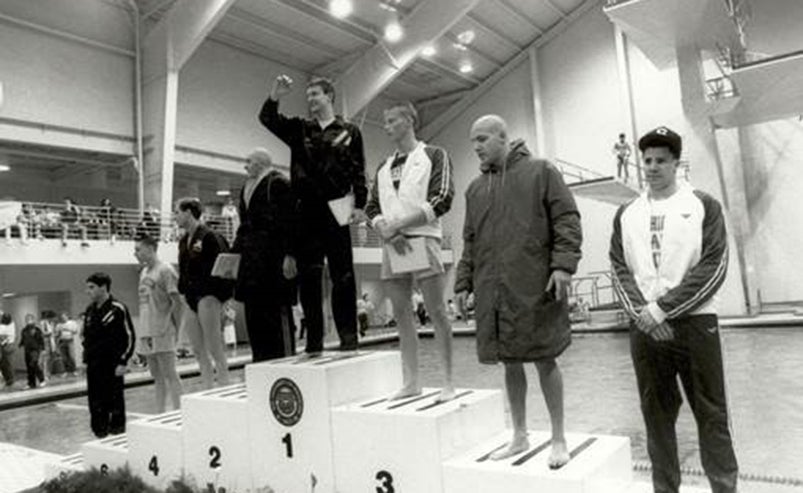 Brent Lang on the podium after winning the 100-yard freestyle at the 1990 NCAA Championships