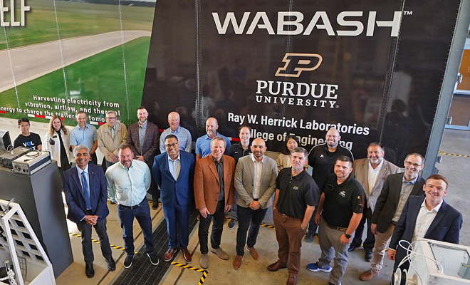 Wabash and Purdue leaders gathered beside a research trailer at Herrick Laboratories