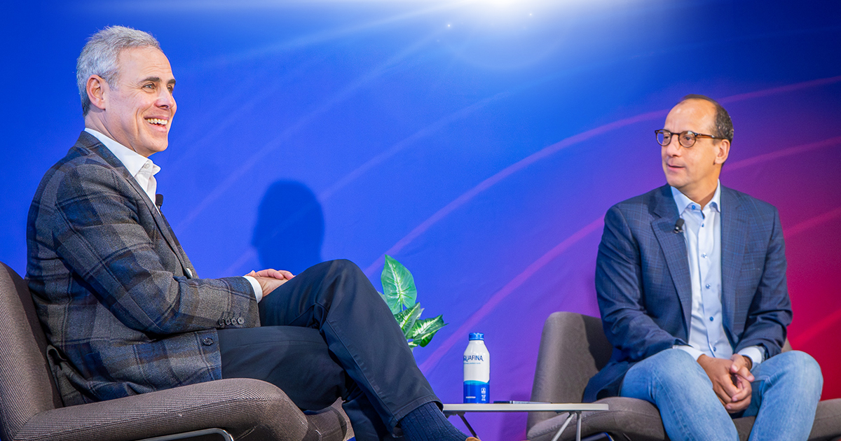 Brett Schulman, left, in conversation with Kogod dean David Marchick on stage