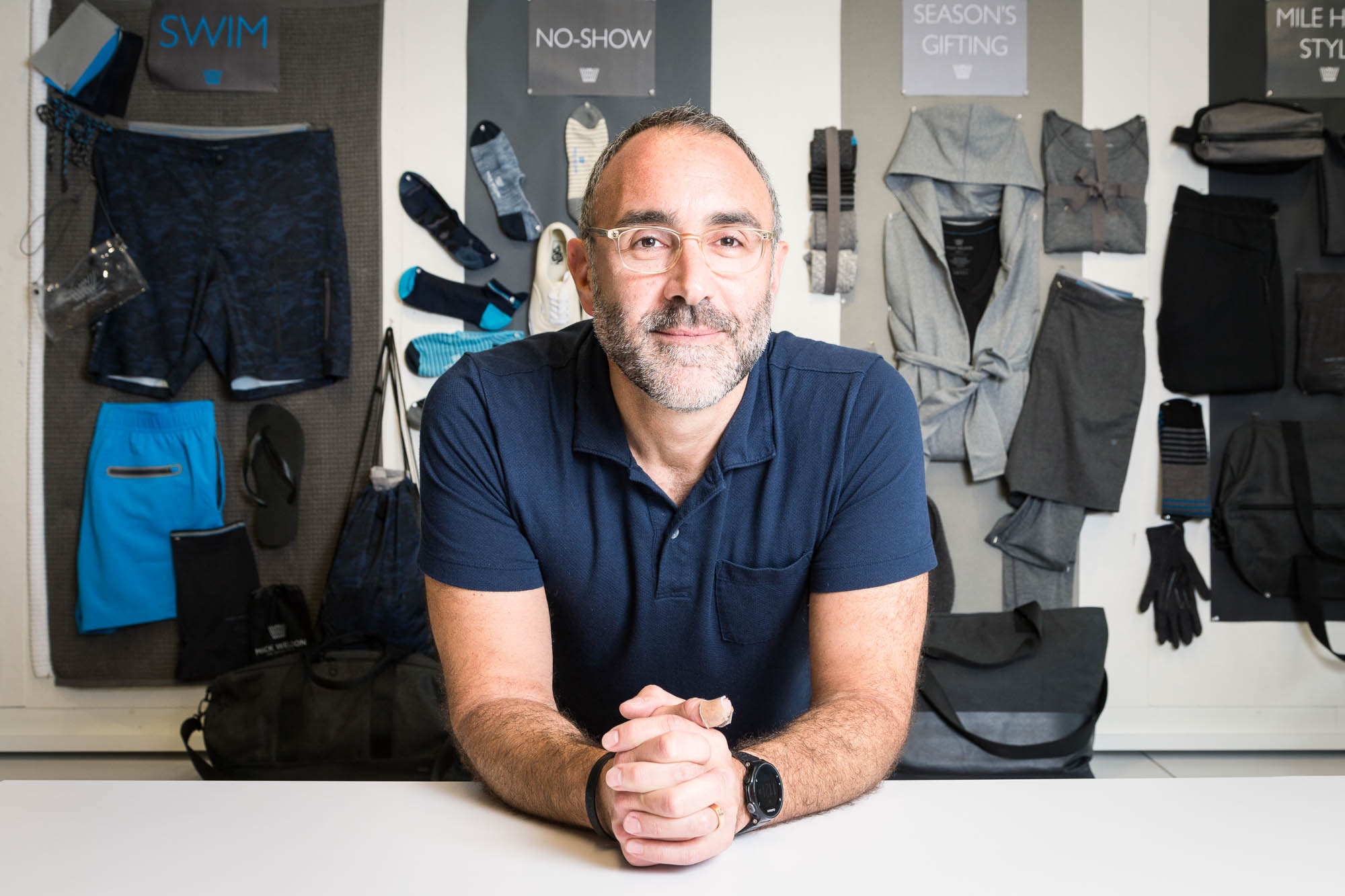 Brian Berger at Mack Weldon’s New York workplace, surrounded by displays of socks, shorts and other clothing