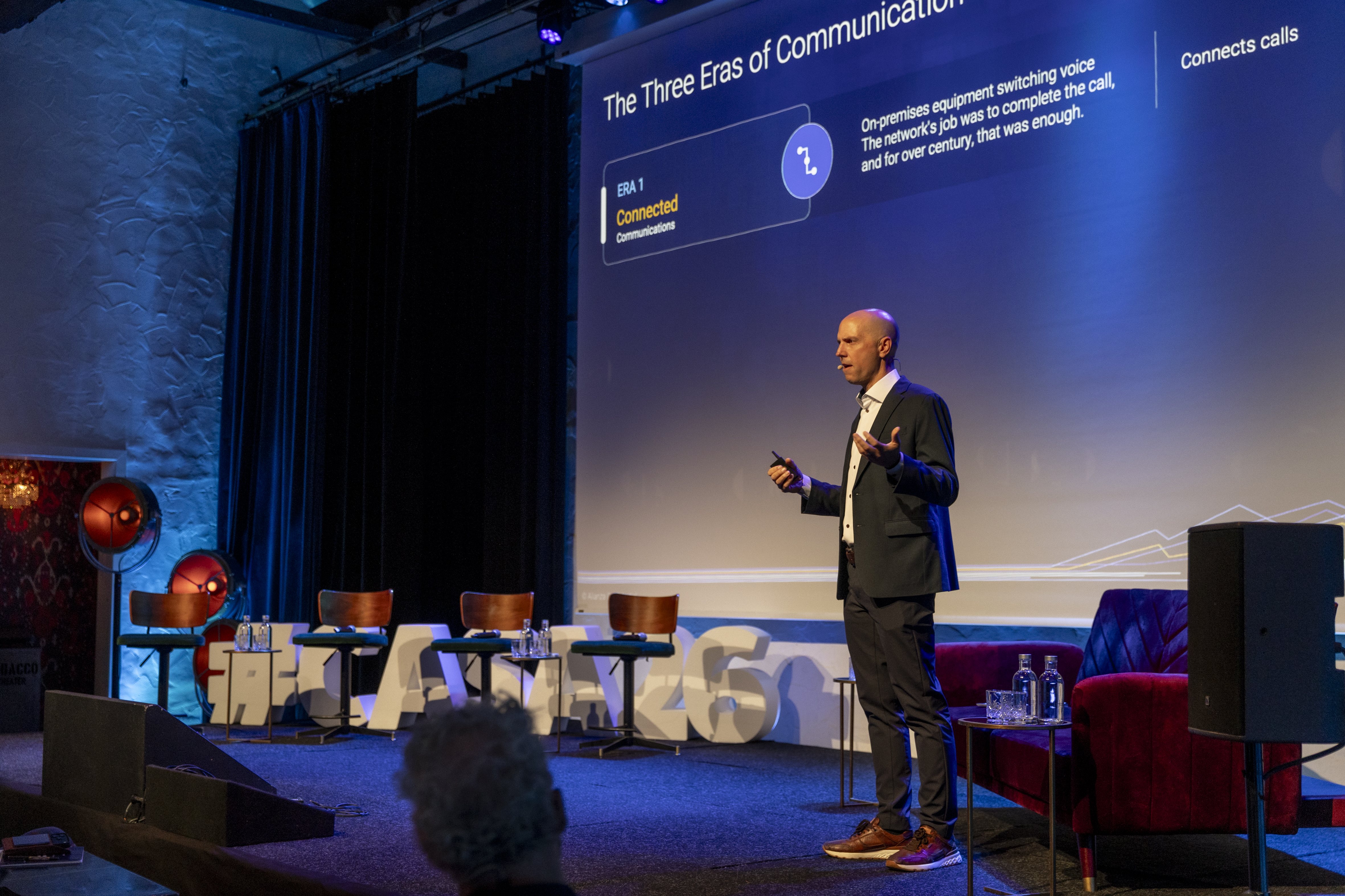 Brian Beutler presenting the three eras of communications on stage at CASA26 in Amsterdam