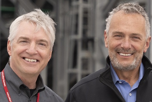 Brian Bird, left, smiling alongside outgoing NorthWestern Energy CEO Bob Rowe
