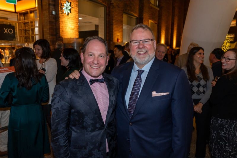 Brian Bloom, left, with co-founder Jolyon Burton at the firm's 2023 holiday party