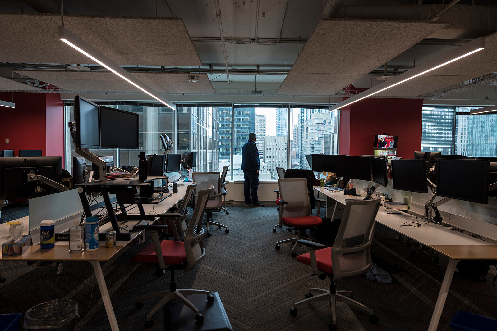 Brian Hartlen stands alone at the windows of Verafin's empty Toronto satellite office in March 2020