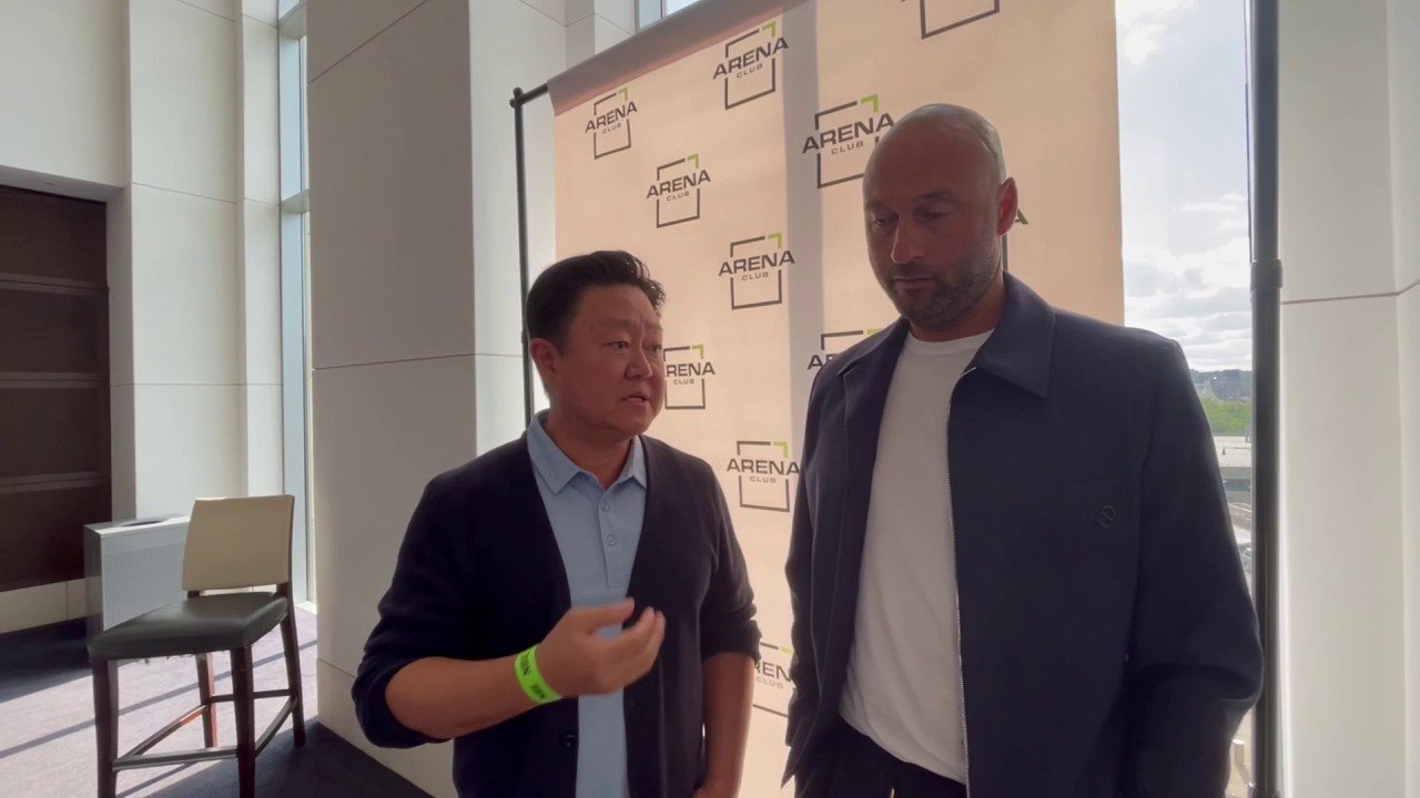 Brian Lee speaking beside Derek Jeter at an Arena Club event