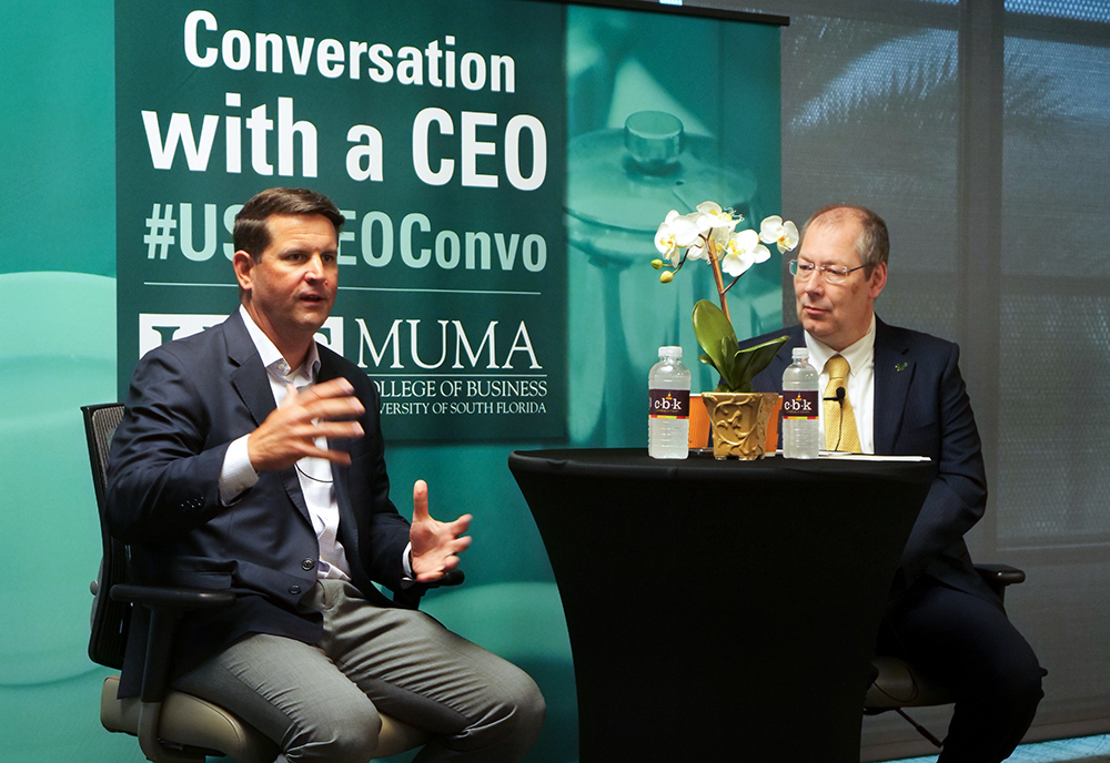 Brian Murphy gestures while speaking with GJ de Vreede at the University of South Florida.