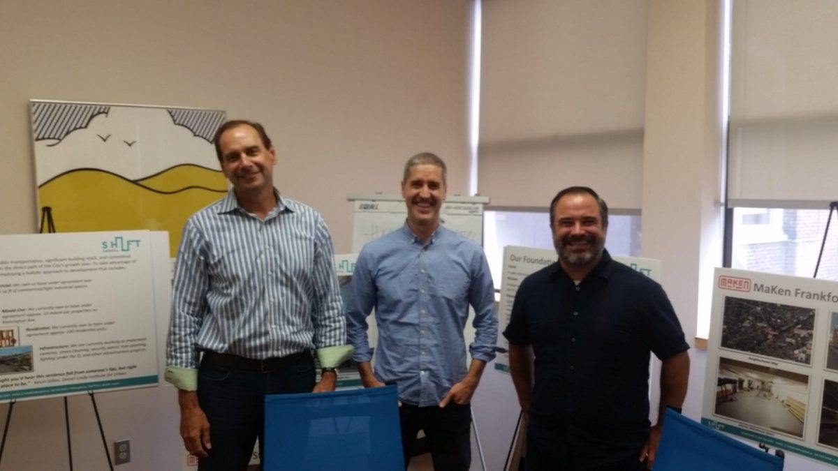 Brian Murray, center, with colleagues at SHIFT's Castor Avenue headquarters in 2016