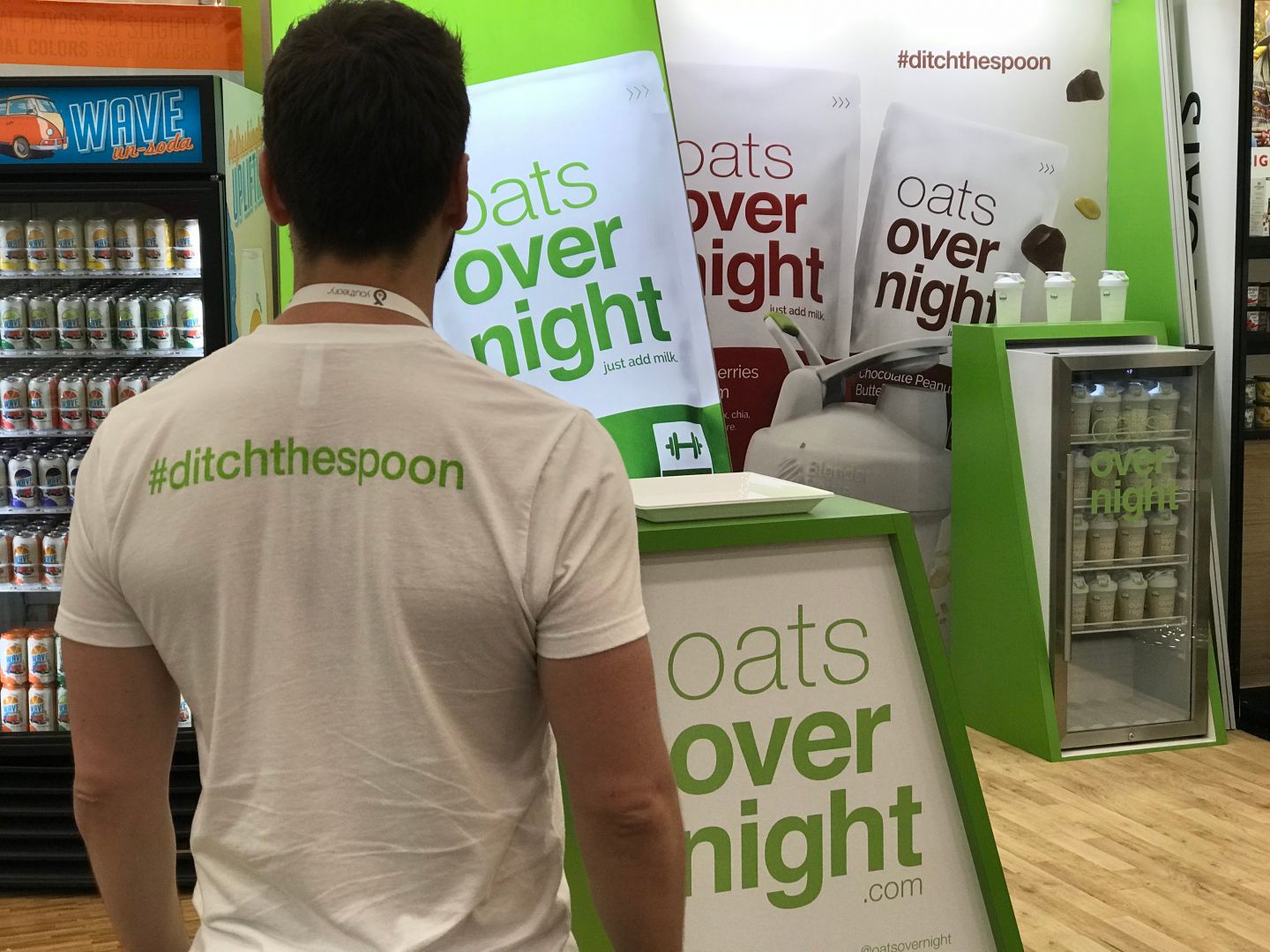 Brian Tate facing an Oats Overnight booth at Expo West