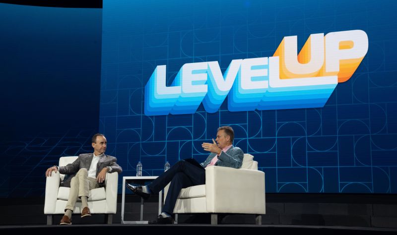 Brian Tyler, seated at left, in conversation with Stanton McComb on a McKesson sales conference stage