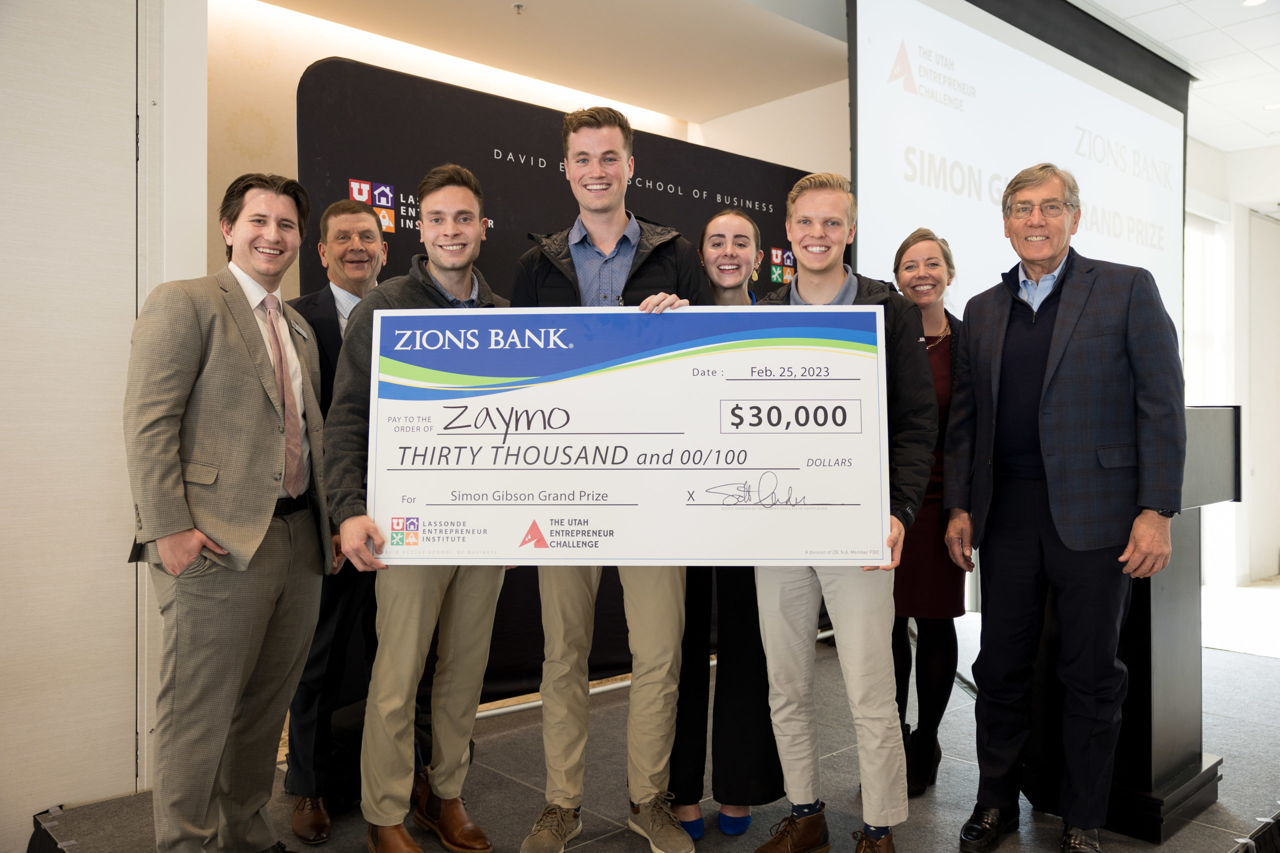 Zaymo team accepting the grand prize at the 2023 Utah Entrepreneur Challenge