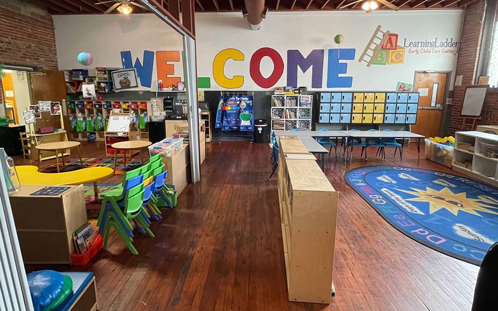 Colorful Learning Ladder childcare room with a welcome sign