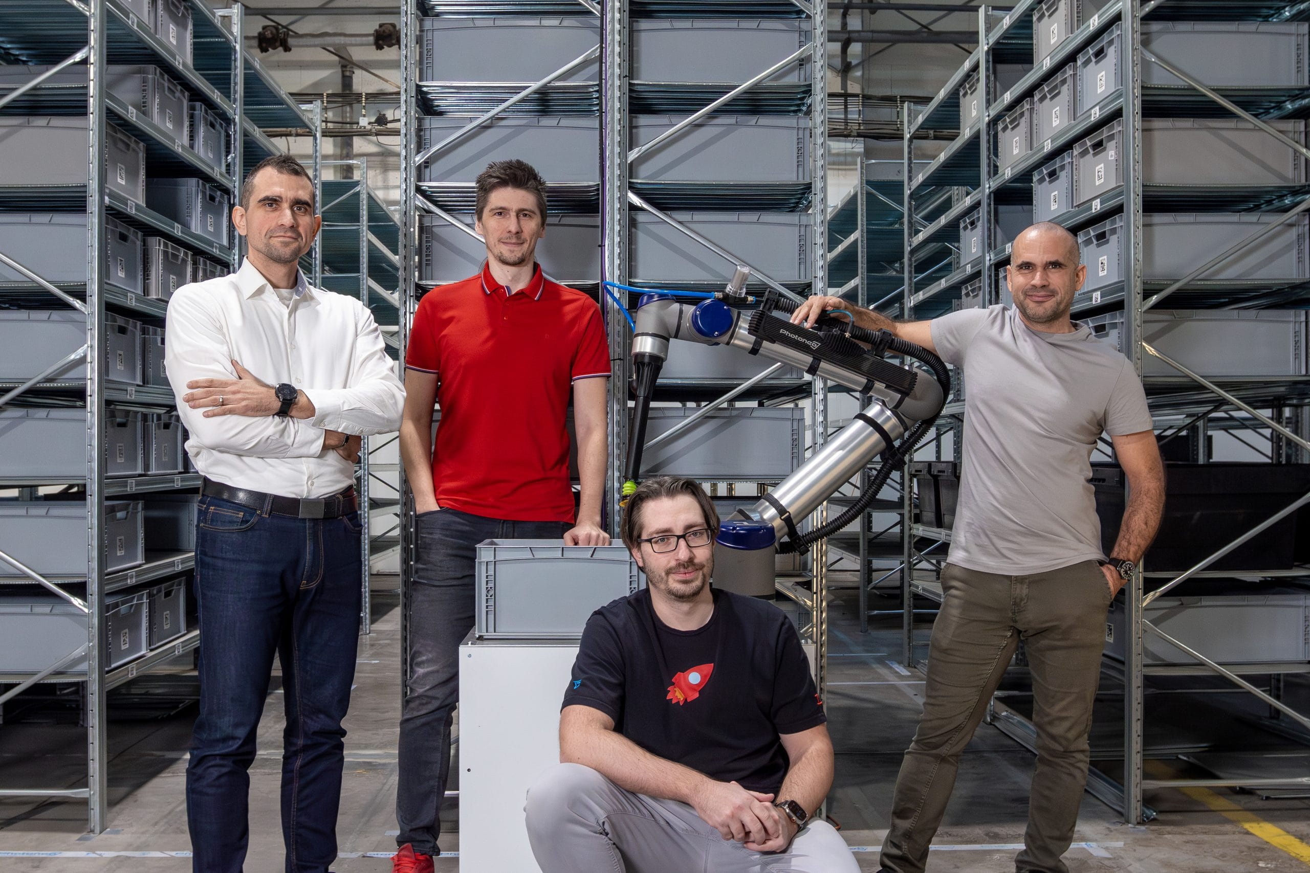 Brightpick founding team with robotic vision equipment in a warehouse