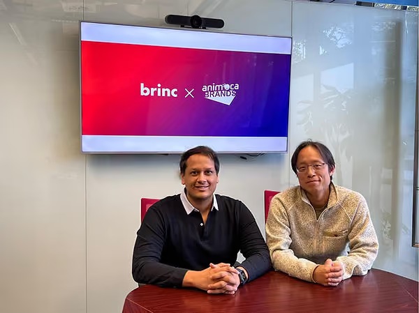 Manav Gupta seated on the left beside Animoca Brands co-founder Yat Siu