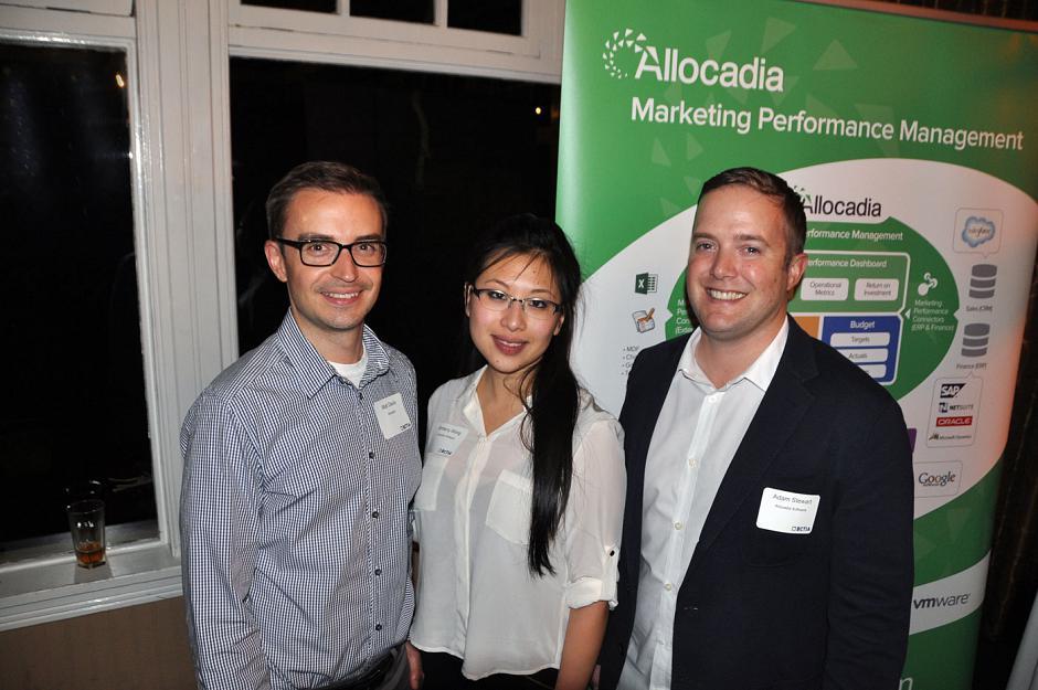 Brittany Wong standing with Allocadia colleagues Matt Davis and Adam Stewart at a Vancouver technology mixer in 2014