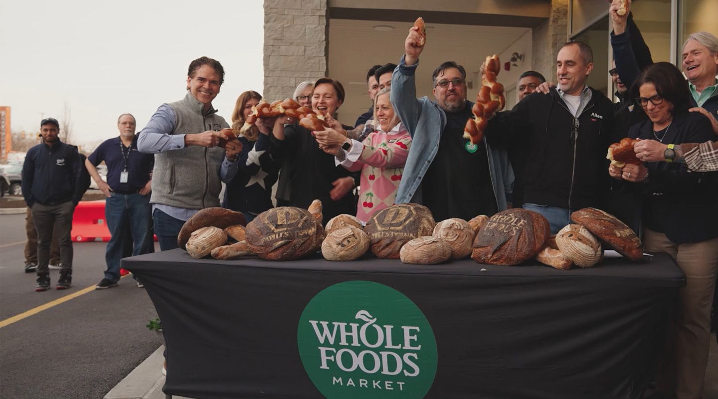Whole Foods Market employees celebrating the opening at Brixmor’s Barn Plaza