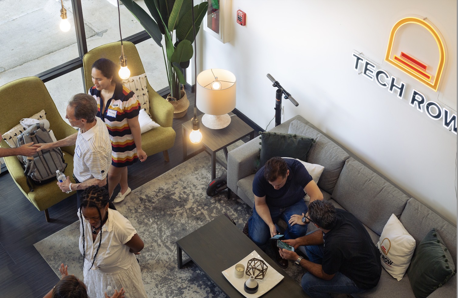Entrepreneurs and community members gathering inside Tech Row in downtown Birmingham