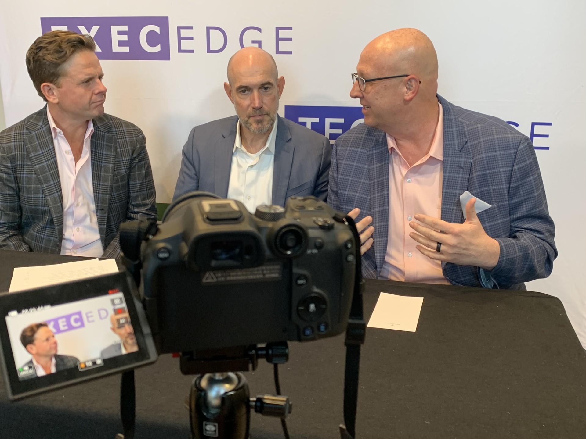 Brooks Schaden, seated in the center, and Shannon McNiel, right, being interviewed by John Jannarone at the 2025 ICR Conference
