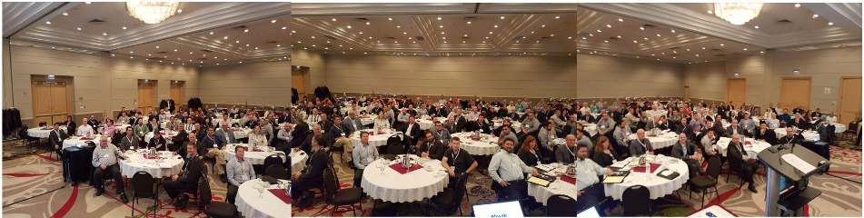 Panoramic view of attendees seated around tables at the 2017 SIMSA-Mosaic roundtable