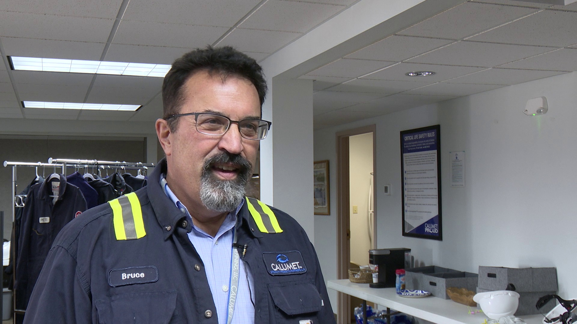 Bruce Fleming wearing Calumet work clothing during a KRTV interview