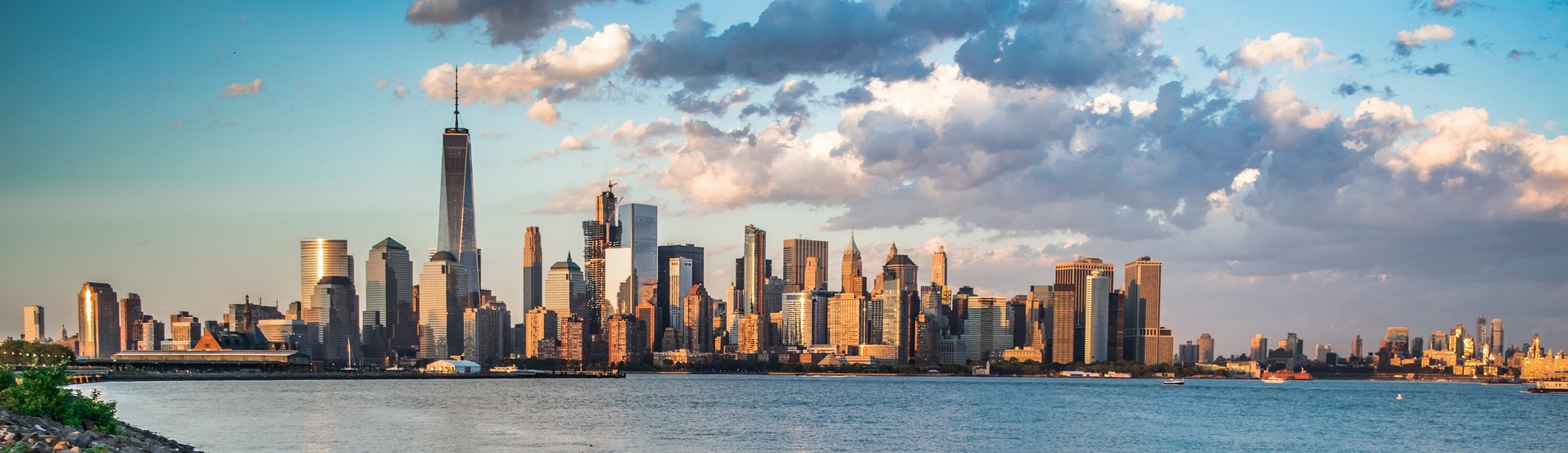 Panoramic photograph of the New York skyline beneath clouds