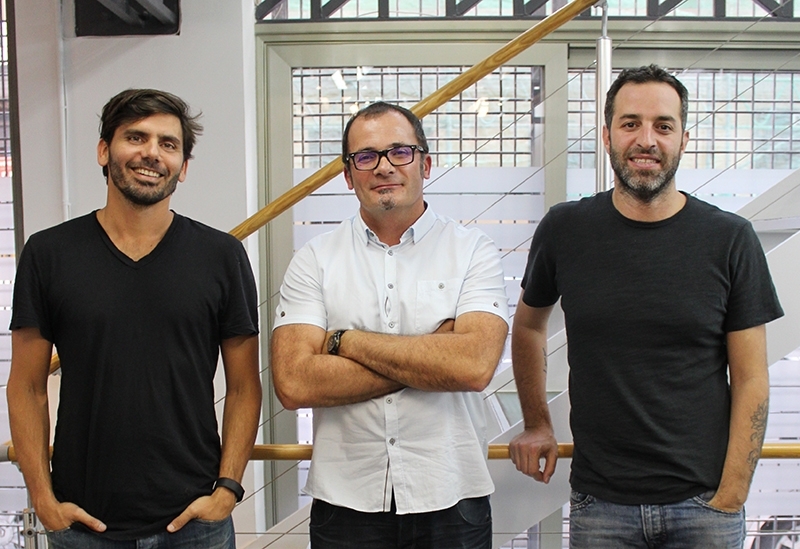 Bruno Lambertini standing with two Circus colleagues in an office