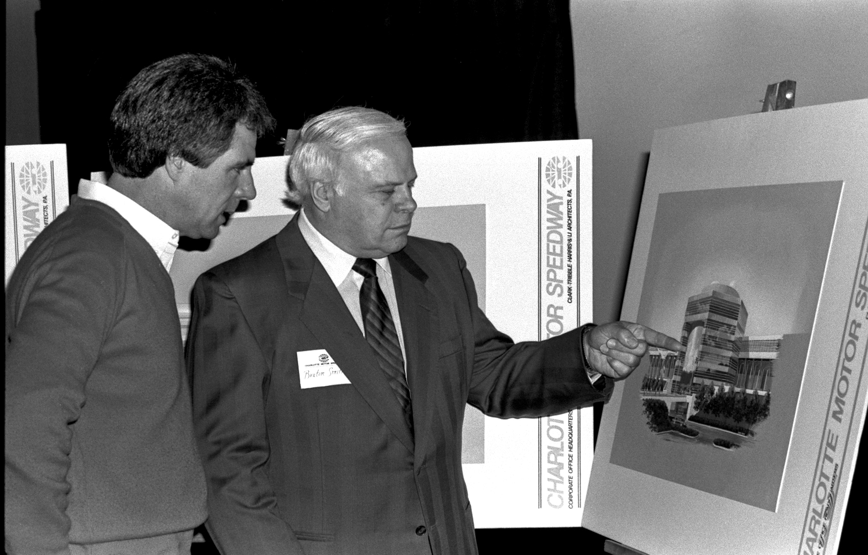 Bruton Smith, right, shows plans for Smith Tower to Darrell Waltrip in December 1985.