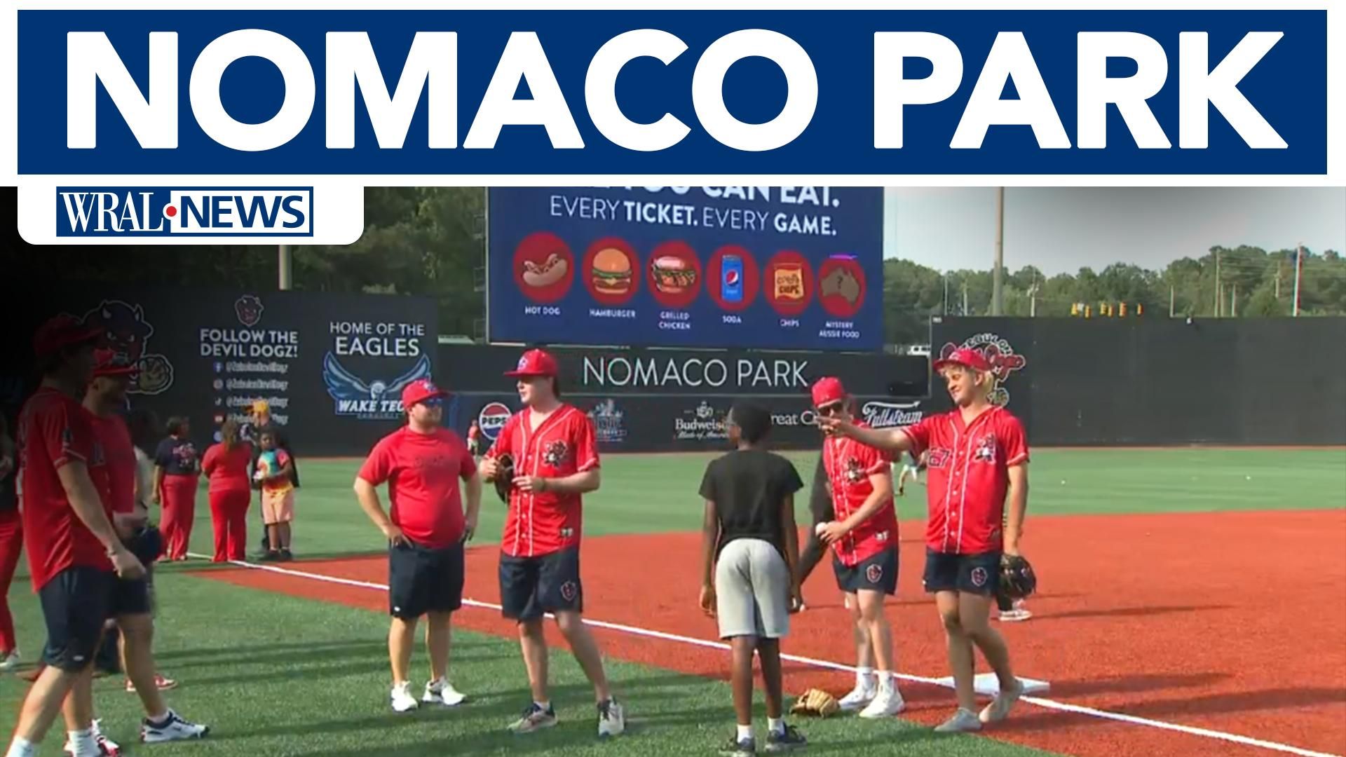 Players and visitors on the field at the newly named Nomaco Park in WRAL’s May 2026 coverage