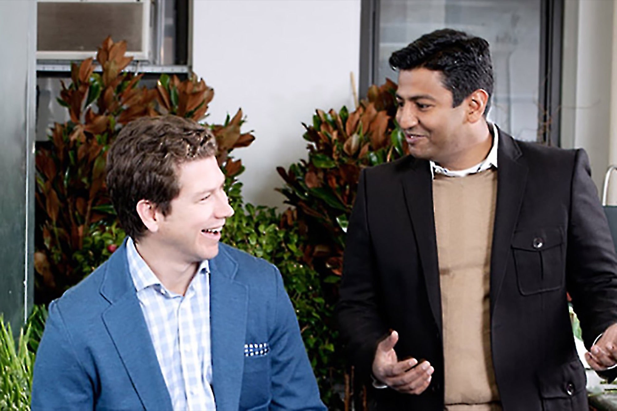 Bryan Burkhart, left, and Sonu Panda together among flowers at H.Bloom