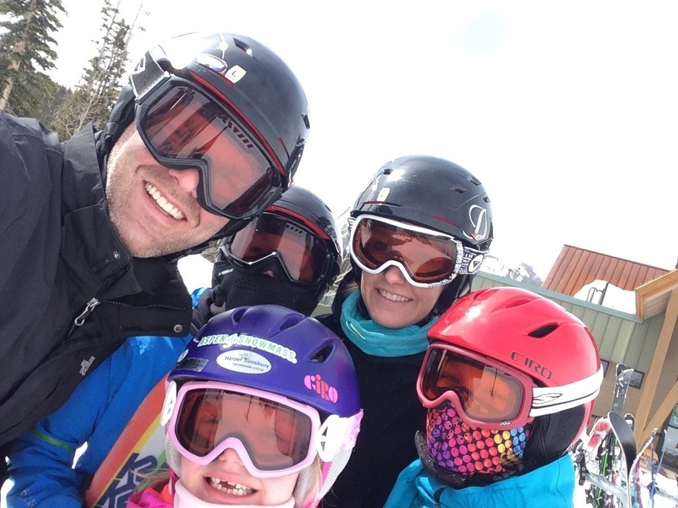 Bryan Sansbury and his family wearing ski helmets and goggles at Snowmass