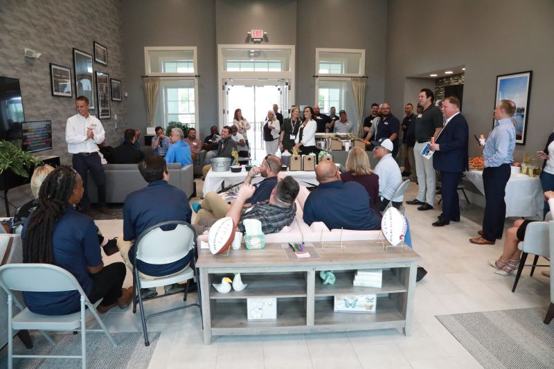 AMH colleagues gathered inside the clubhouse at The Ponds at Walden Woods in Florida