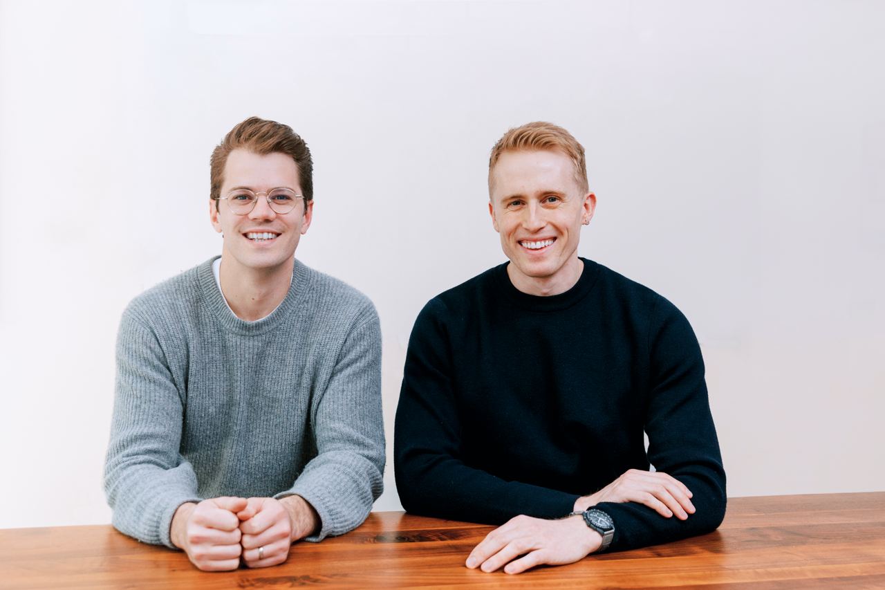 Turnkey co-founders Jack Kearney, left, and Bryce Ferguson, right, seated together at a wooden table
