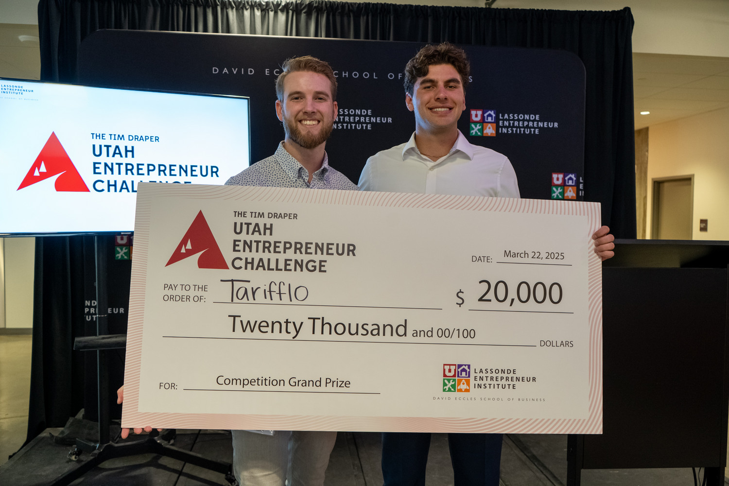 Tanner Helms and Bryce Judy holding Tarifflo's 20000 dollar Utah Entrepreneur Challenge prize check