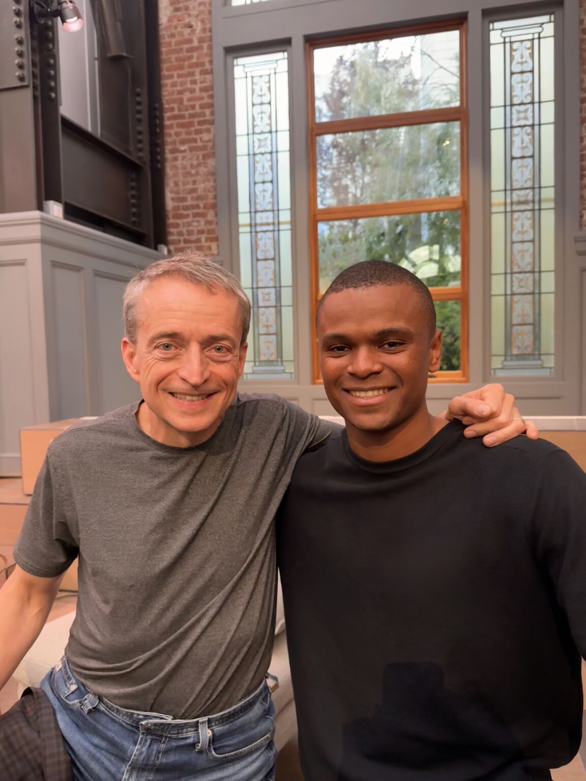 Bryce Neil smiling beside former Intel CEO Pat Gelsinger after an industry talk