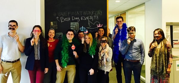 KRC Research team posing with feather boas, glasses, and party props during Biddle’s spring 2016 internship