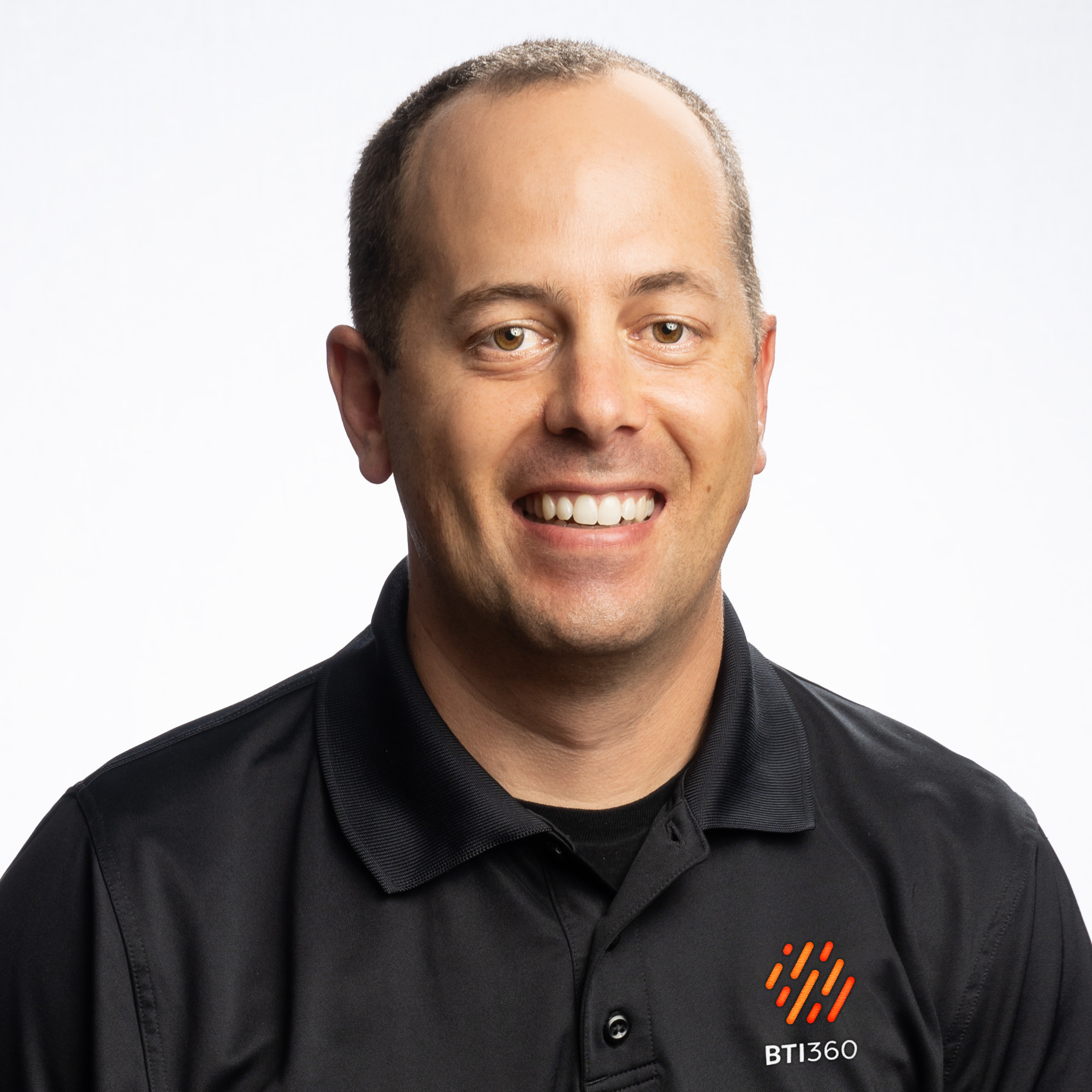 BTI360 co-founder and CEO MJ Wivell wearing a black company polo
