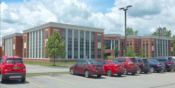 Brick exterior of Buffalo Medical Group’s South Transit Road office in Lockport, with cars parked outside