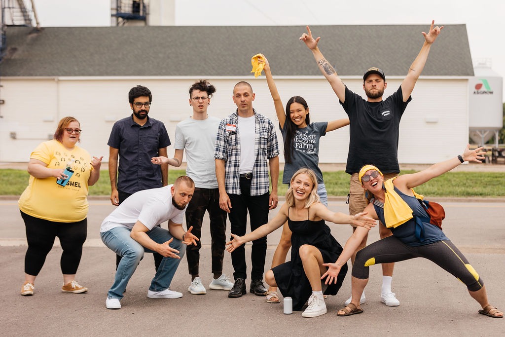 Bushel teammates pose together outdoors at the company’s Arthur gathering