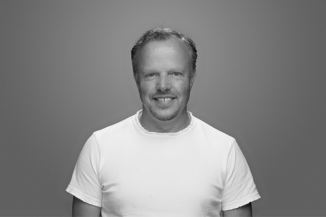 Black-and-white portrait of founder Patrick van der Pijl