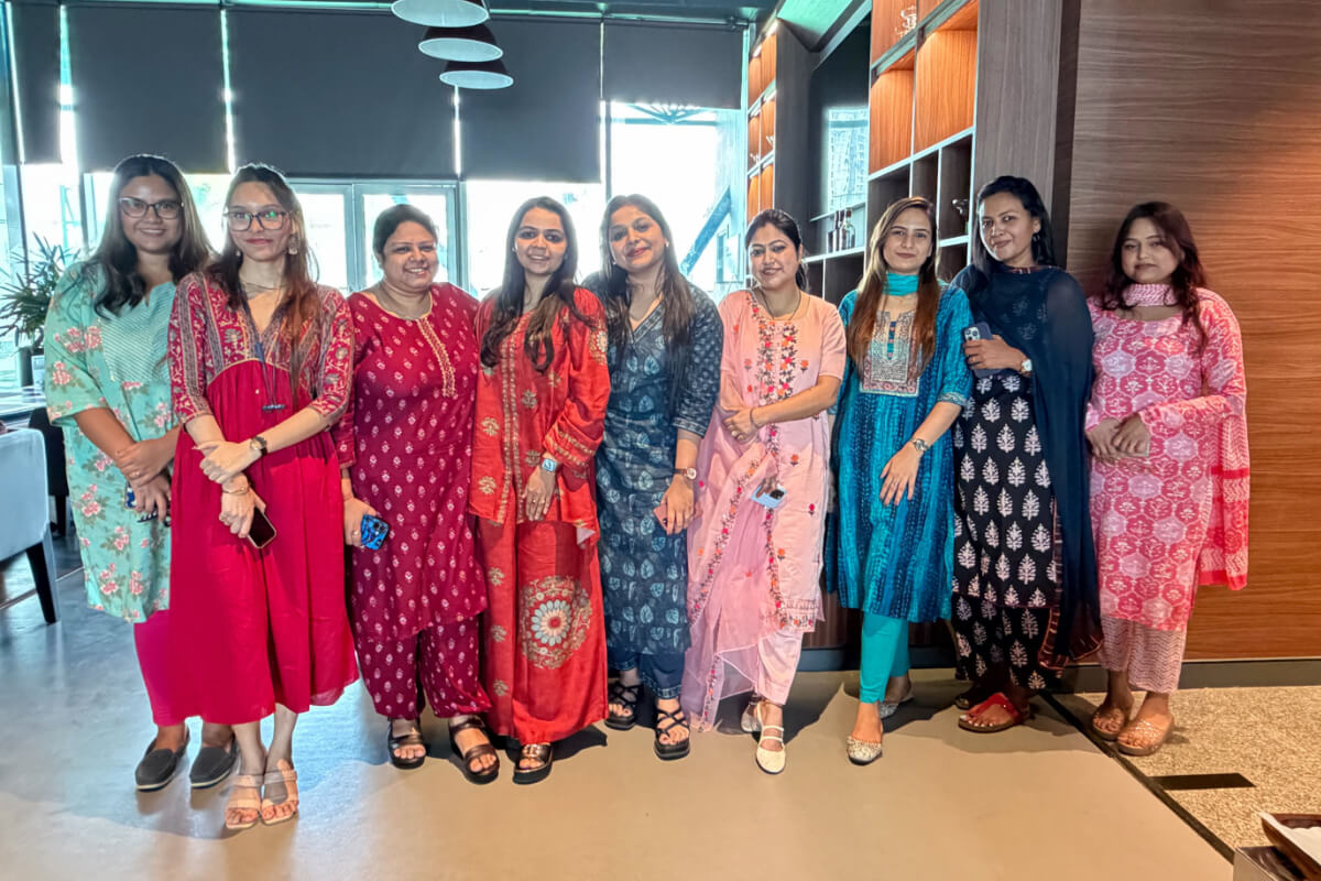 BuyerForesight team members gathered in an office lounge
