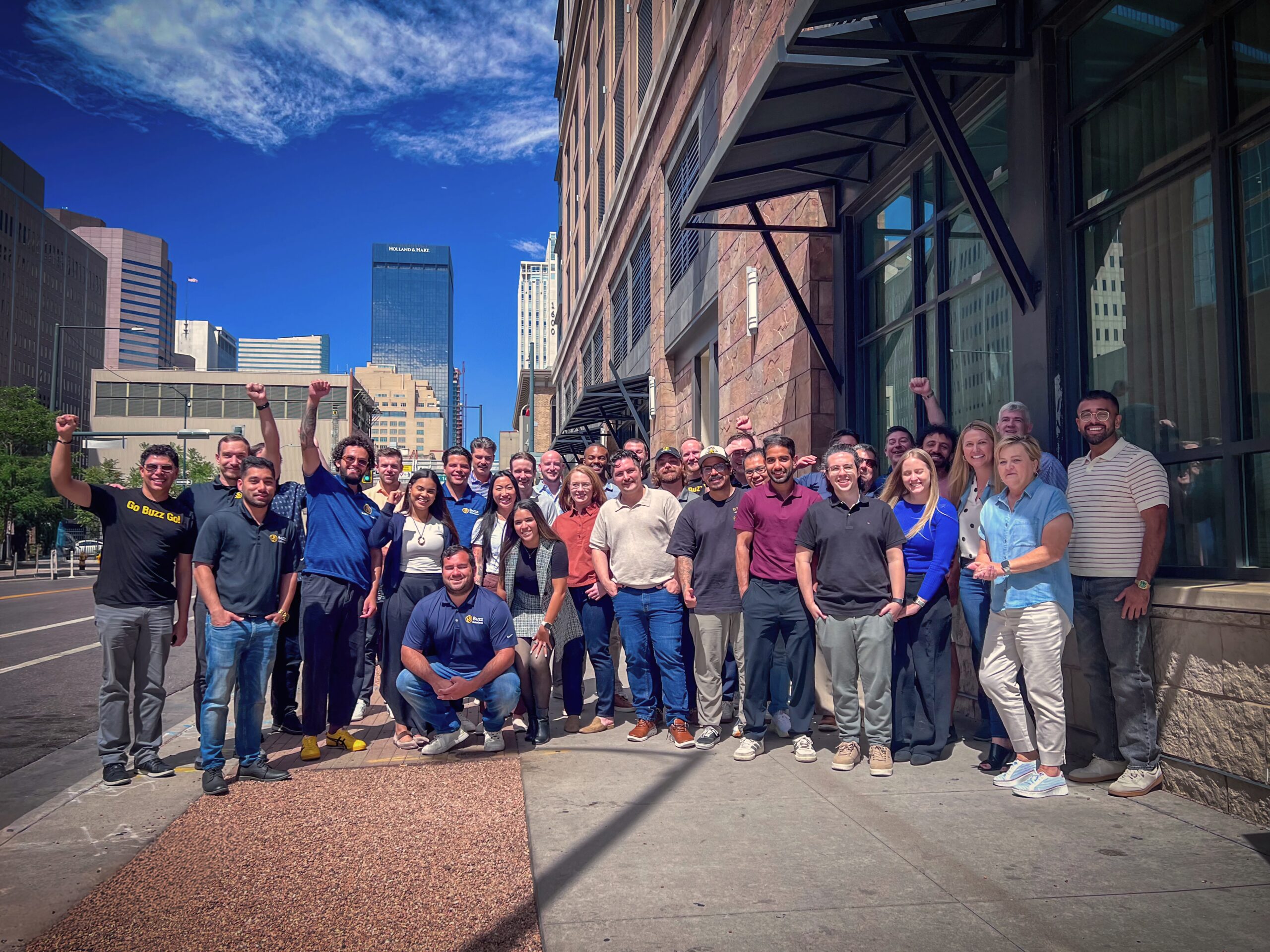 Buzz Solutions team gathered outside an office building