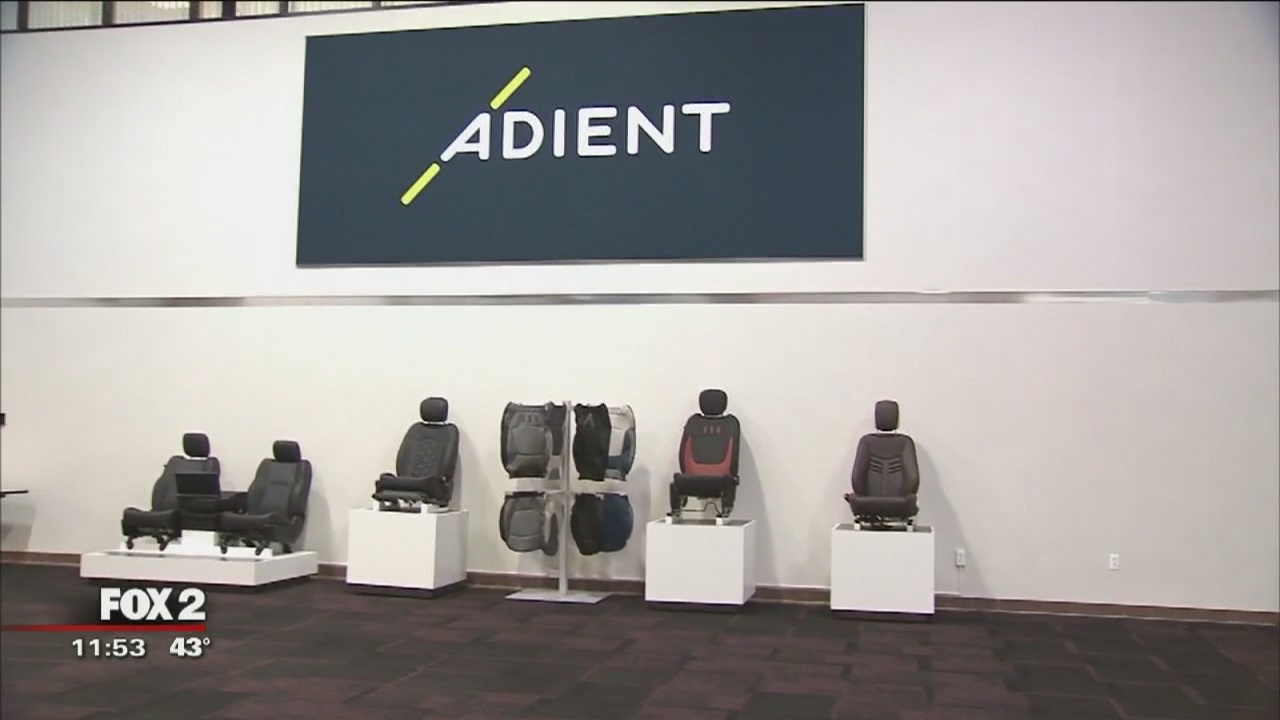 Automotive seats and seat components displayed beneath the Adient name