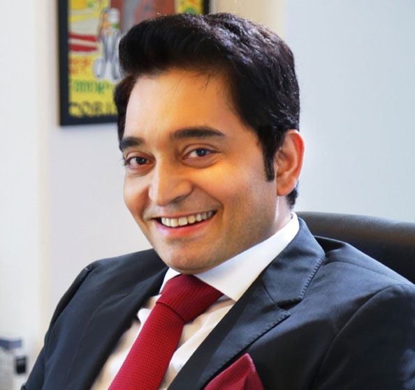 C Ahead founder and CEO Sandeep Sekhar in a suit and tie