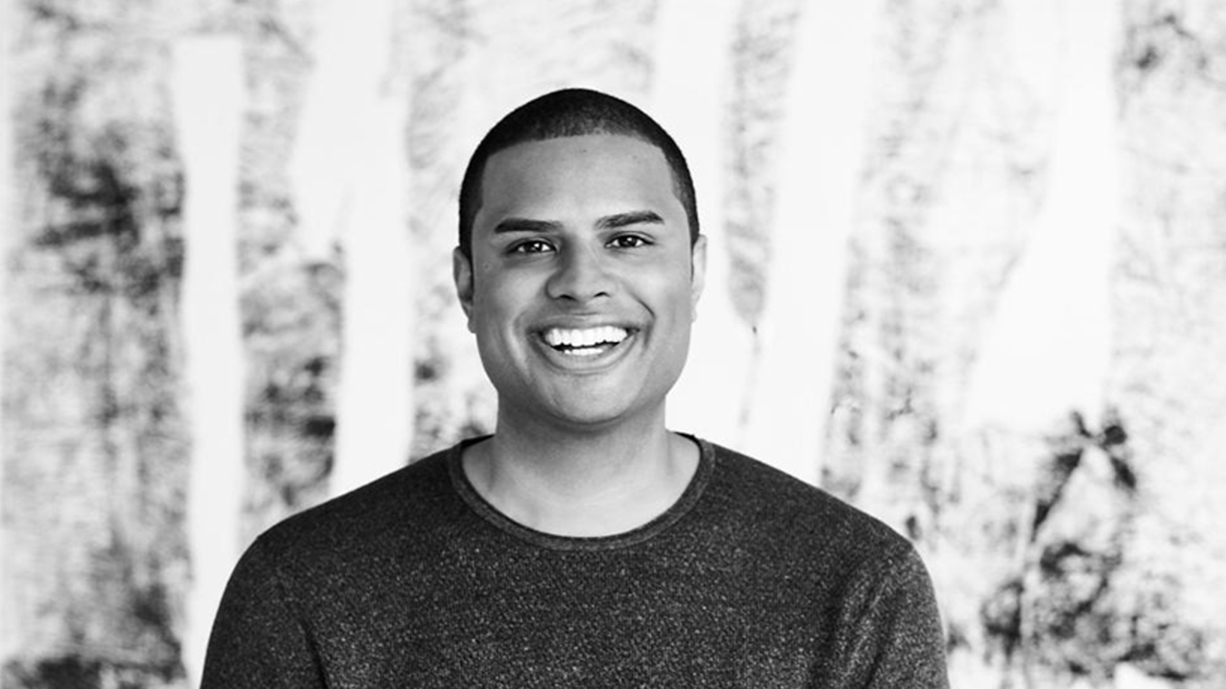Cadre co-founder Ryan Williams smiling in a black-and-white portrait