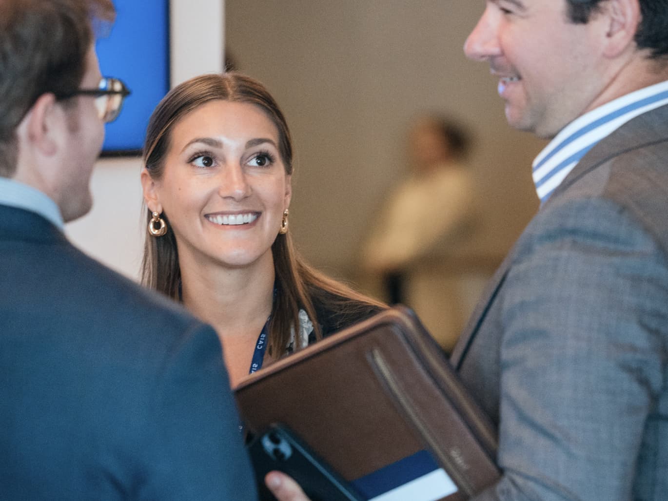 CAIS employees in conversation at a company gathering