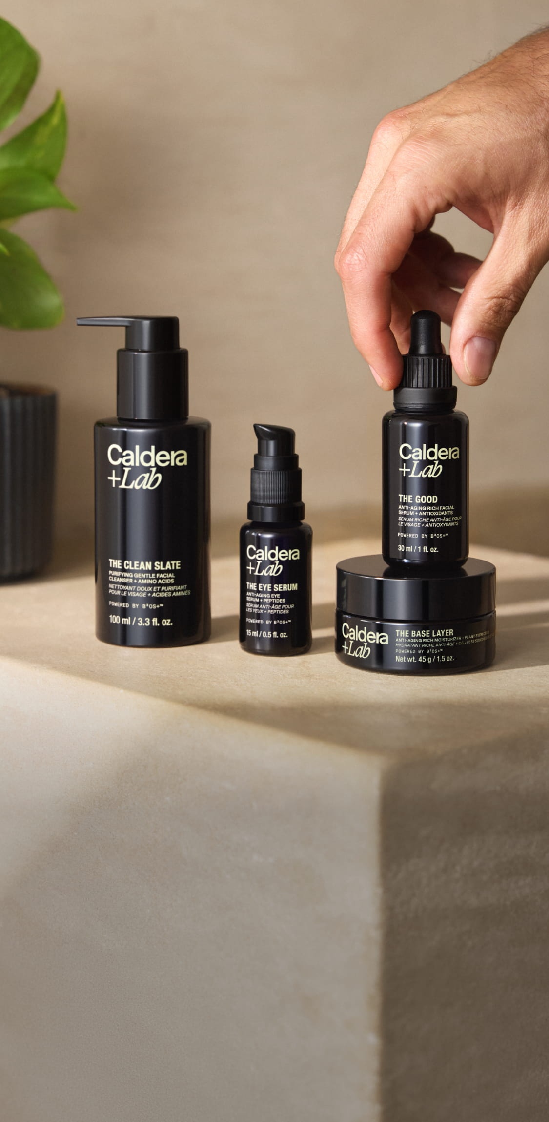 Caldera + Lab cleanser, eye serum, rich moisturizer and The Good serum on a stone surface