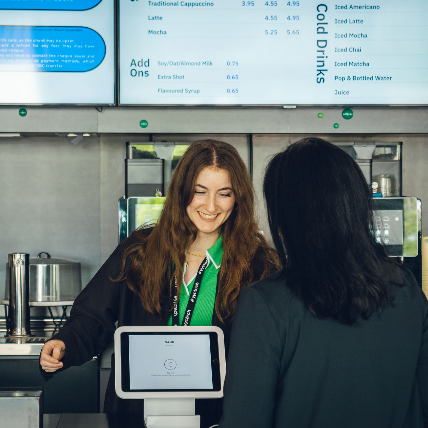 Two people interacting at the Platform café counter