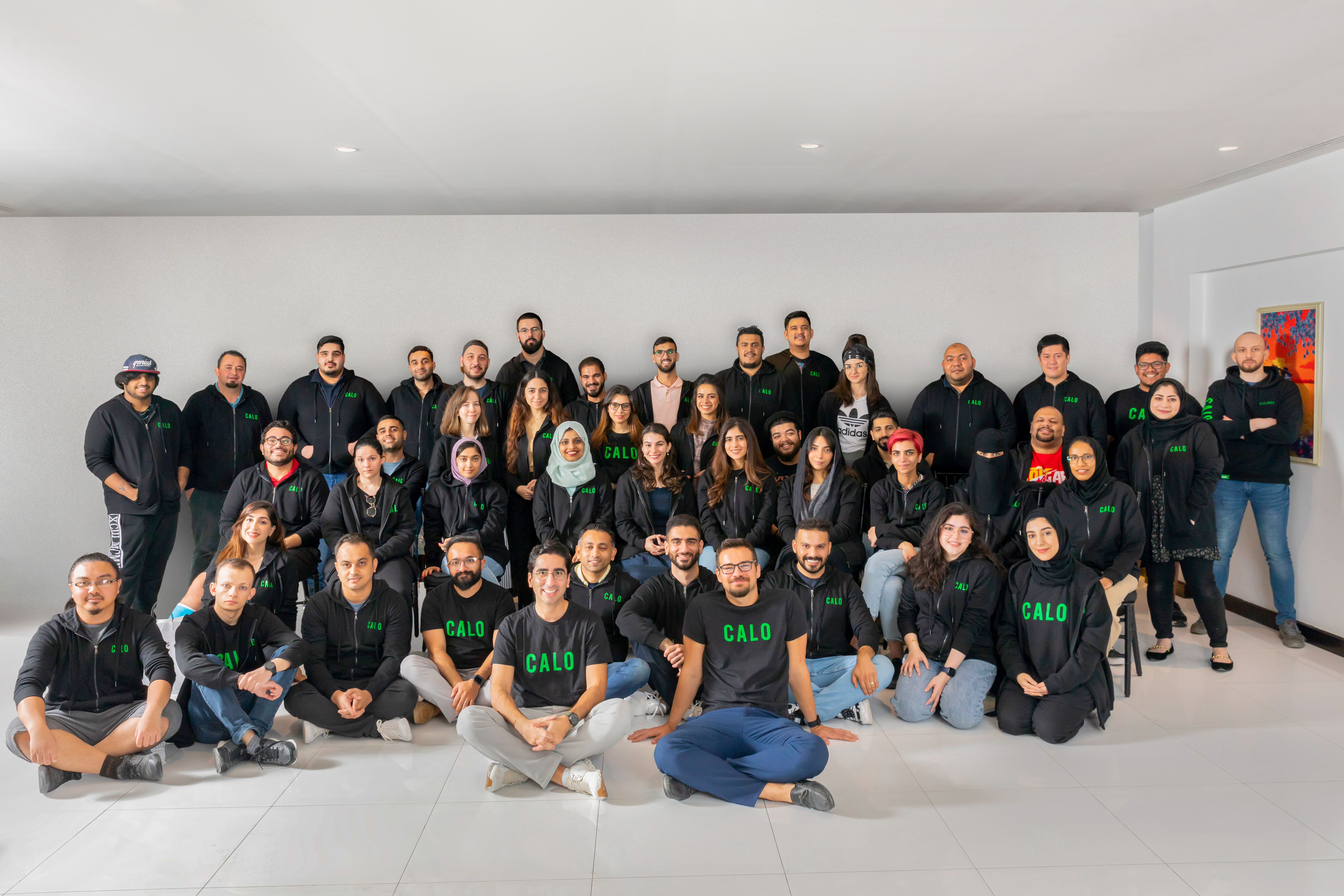 Calo team members posing together in an office