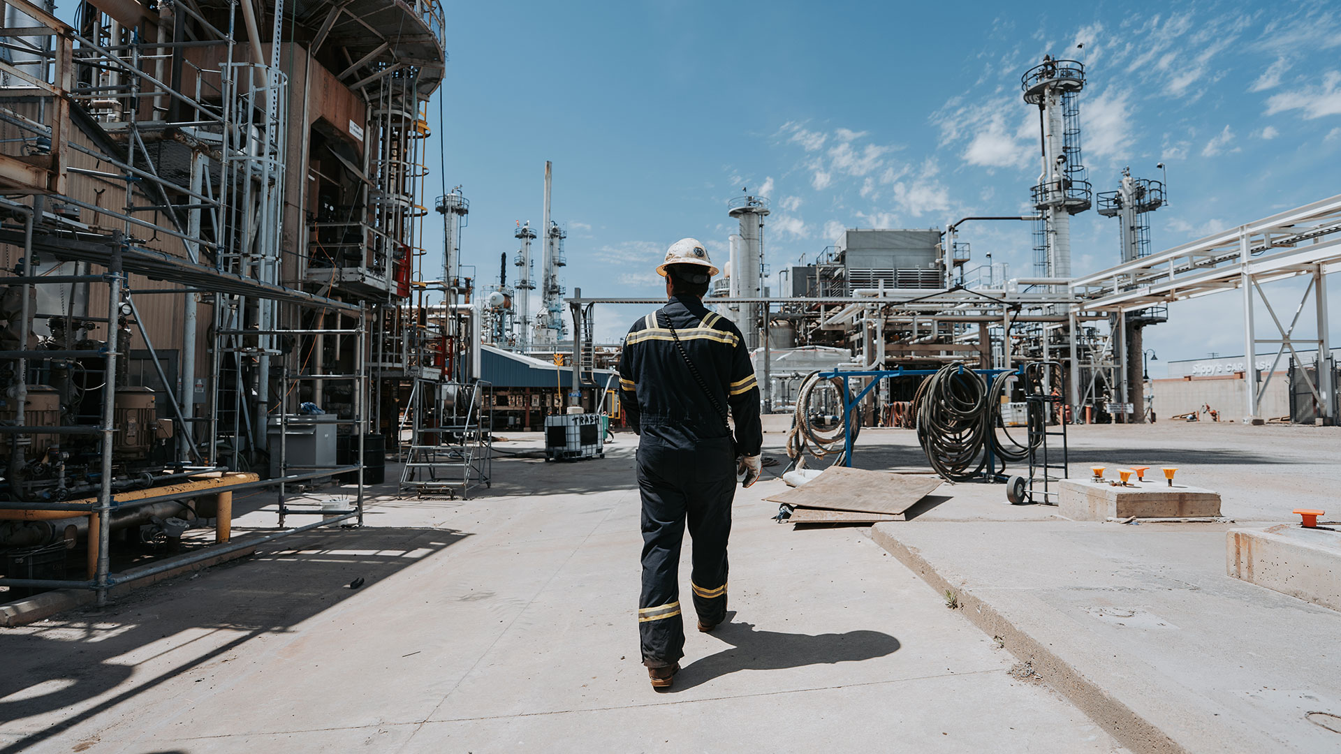 A worker walking through the Montana Renewables industrial facility