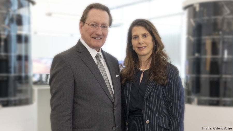 Calvin and Orsula Knowlton standing together in an office
