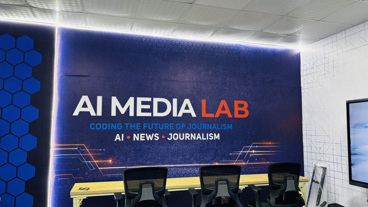 AI Media Lab room in Uganda with a large sign reading AI Media Lab